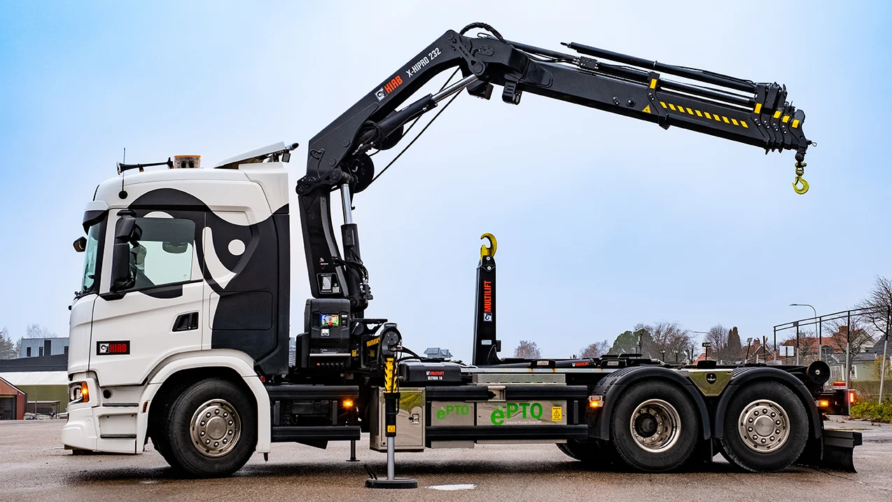 Loader crane operator safely handling a commercial load in Kingston upon Thames